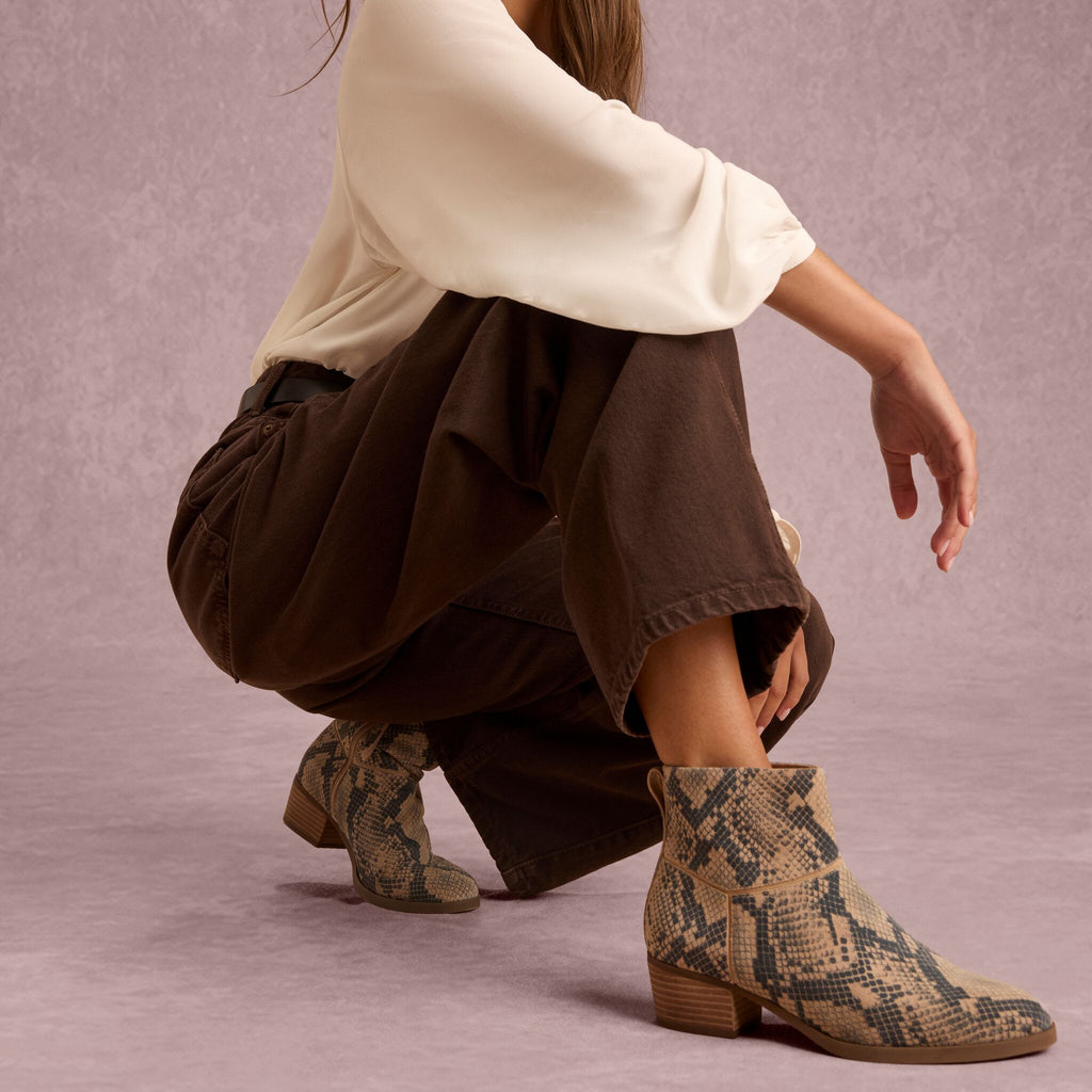 On model image of the Womens Elia Ankle Boot Taupe Snake Print Suede