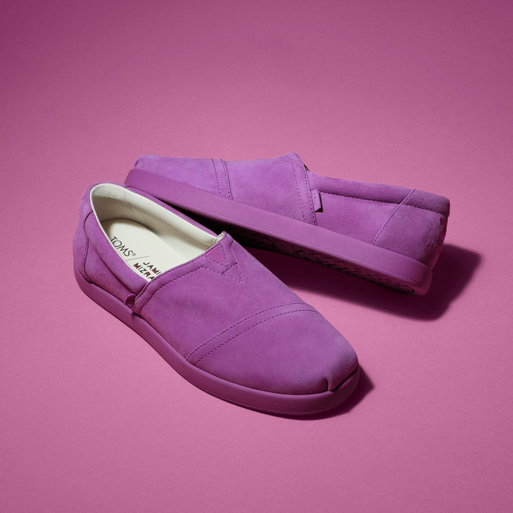 Laydown image of the women's purple suede Jamie Mizrahi Alp FWD