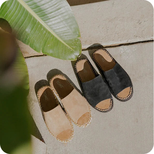 Various TOMS footwear shown.