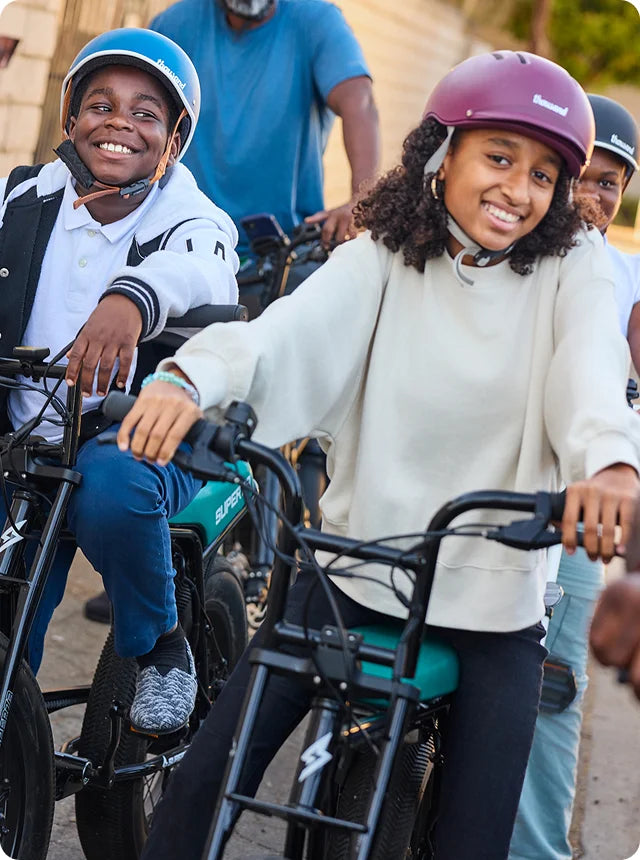 Kids from the East Side Riders Bike Club riding bikes.