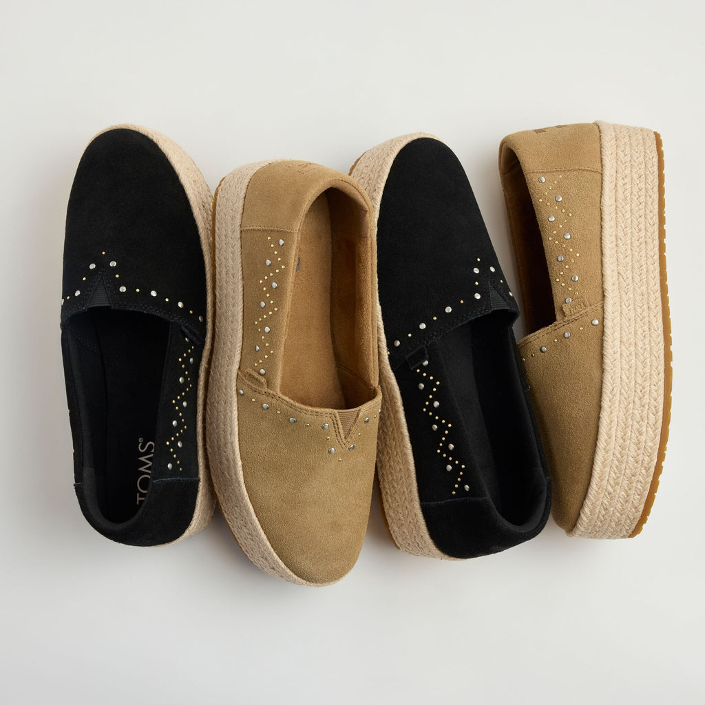 Laydown detail image of the black and toffee suede Valencia platform espadrille with stud details