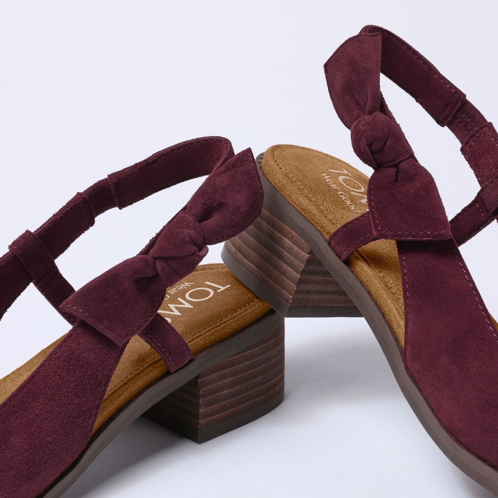 Laydown detail image of the burgundy suede Jaclyn Bow Heel
