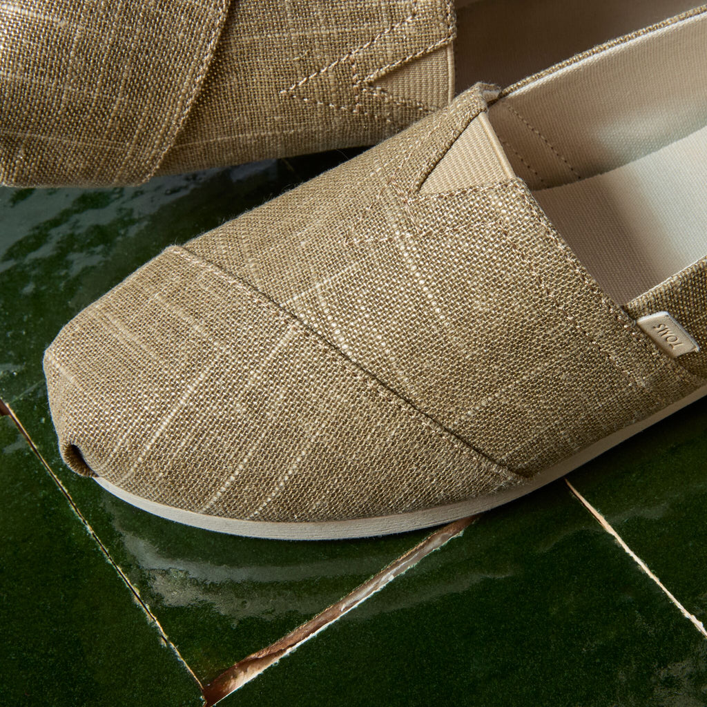 Laydown detail image of the gold shimmer Alpargata