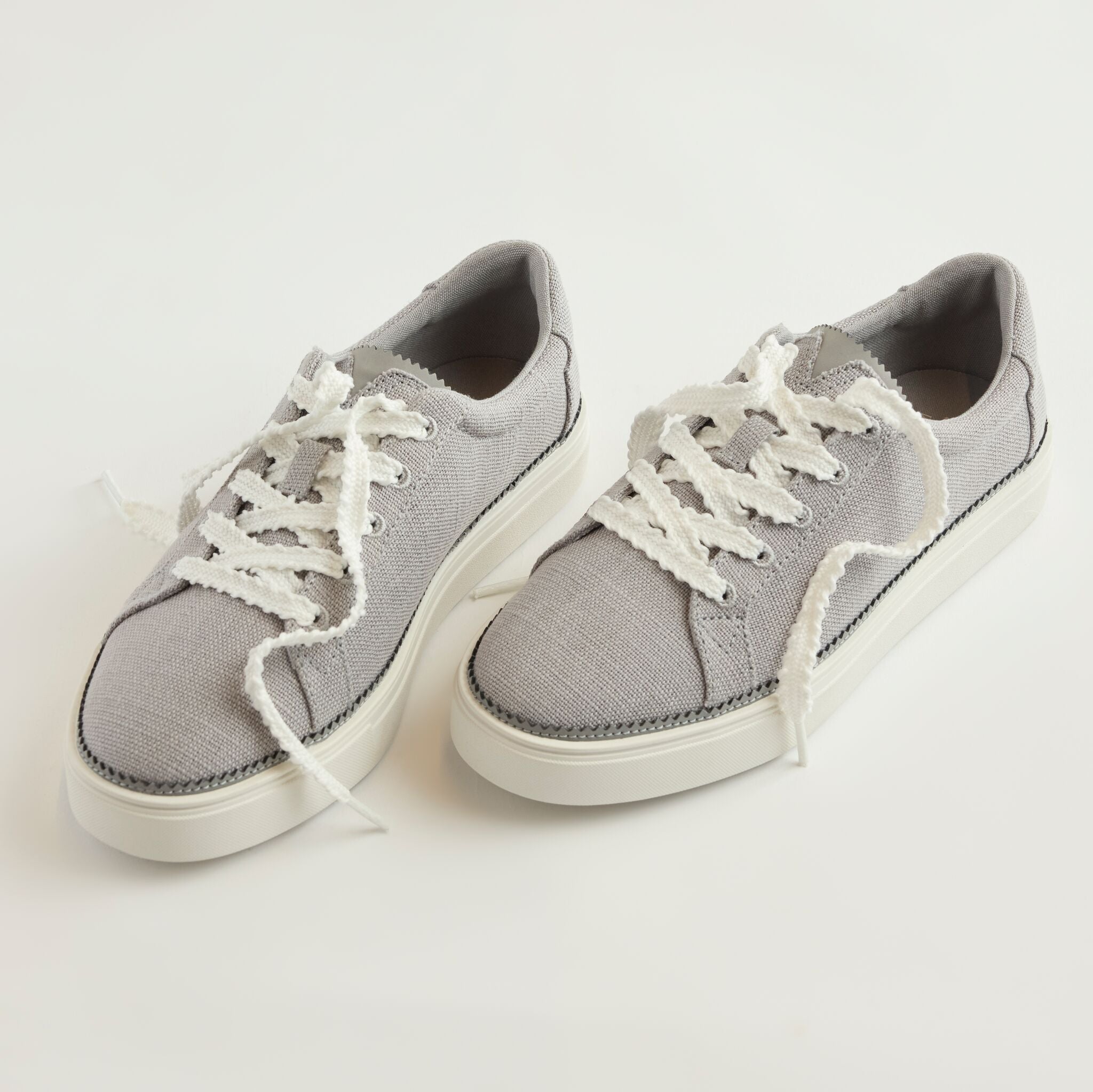 Laydown detail image of the drizzle grey lace up Izzy sneaker